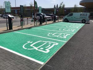 Green EV bay on blocks in paint 2